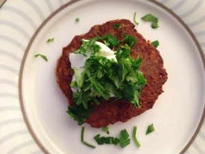 chickpea pancake topped with yogurt and parsley 